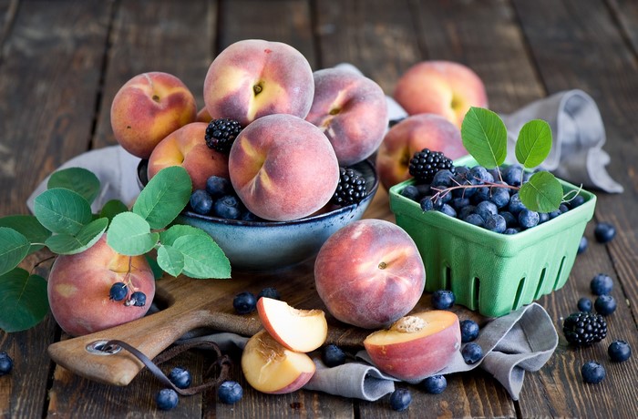 Peaches, Blueberries, and Blackberries on Wooden Table