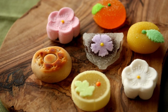 Assortment of Japanese Wagashi sweets on a wooden board
