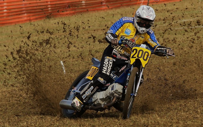 Motorcyclist in Hagon Shocks racing gear on dirt track