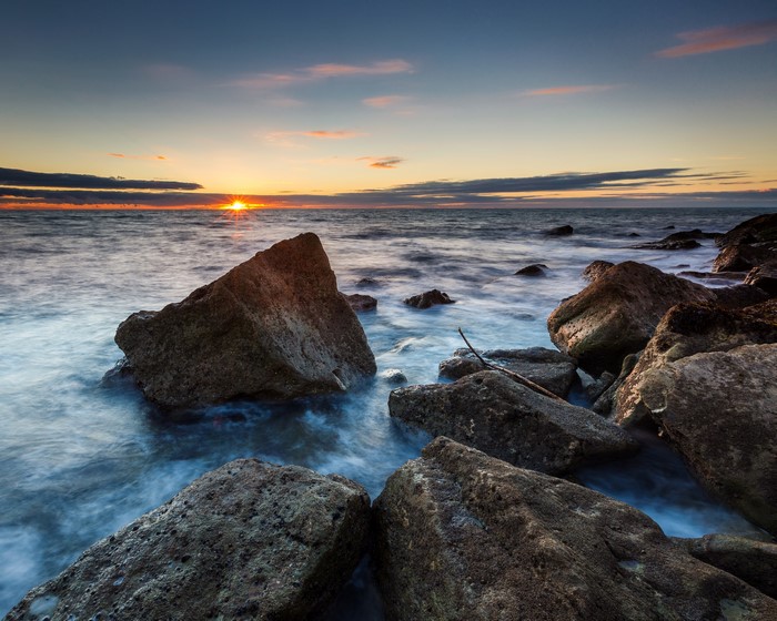 Sunset over the rocky coast of Portland, England