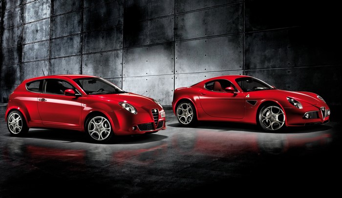 Two red Alfa Romeo cars