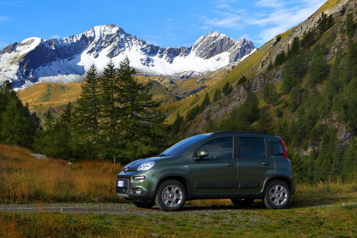 Green Fiat Panda 4x4 in a mountain landscape