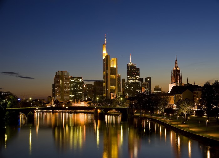 Frankfurt skyline at night with river reflection