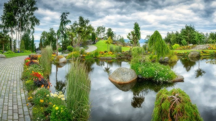 Park with pond and flower beds
