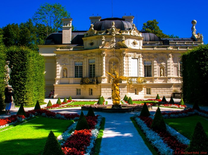 Linderhof Palace gardens with golden statue in Bavaria, Germany