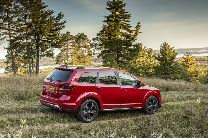 Red Dodge Journey Crossroad in a Natural Landscape
