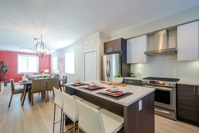 Modern kitchen and dining area with island and table