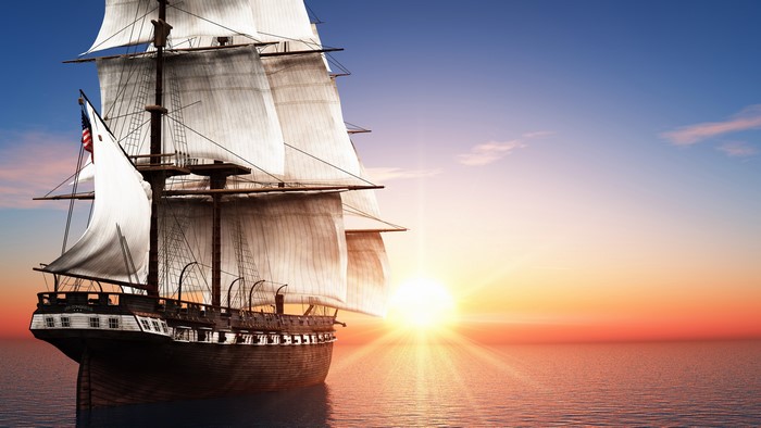 Tall Ship Sailing at Sunrise