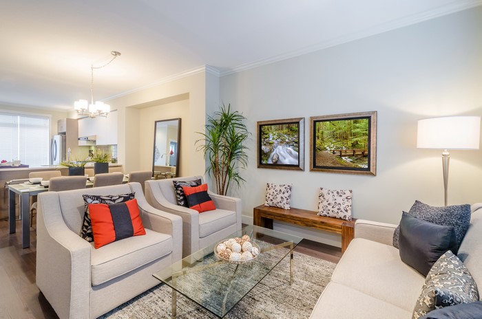 Living room with armchairs, coffee table, and dining area