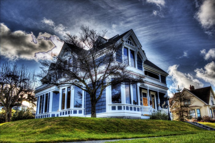 Victorian House in Washington on a Grassy Hill