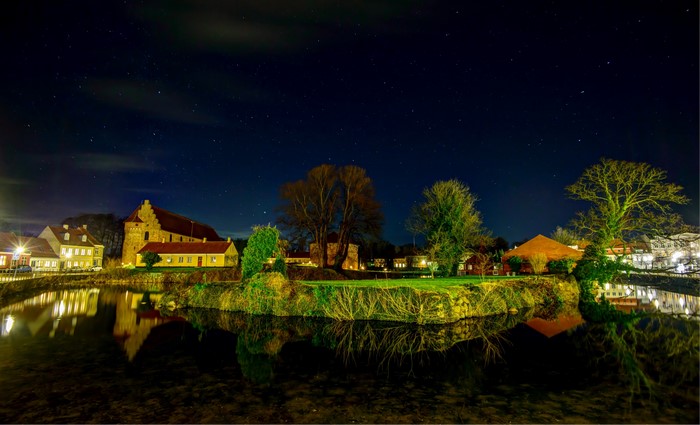 Nyborg Castle and houses at night