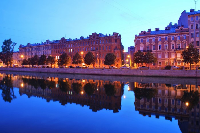 Buildings along a canal in St. Petersburg at dusk