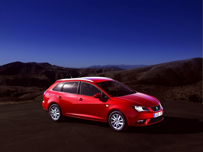 Red 2012 Seat Ibiza ST at night