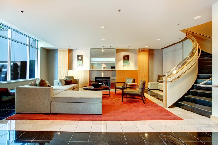 Living room with sofa and spiral stairs