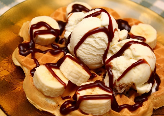 Waffles with ice cream, bananas, and chocolate sauce