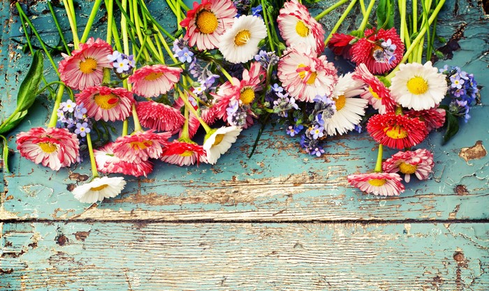 Bouquet of Daisies and Forget-Me-Nots on Rustic Wood