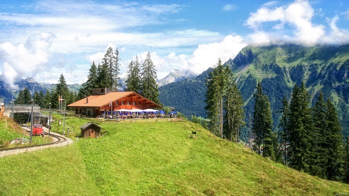 Mountain restaurant with train tracks in Lauterbrunnen, Switzerland