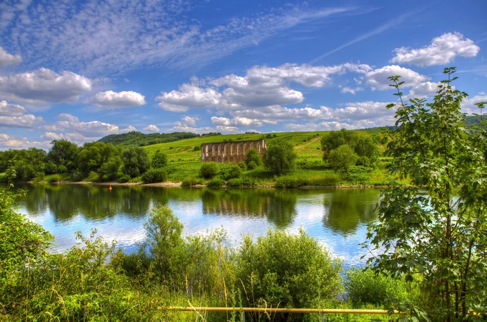 River landscape with ruins and vineyards in Bremm, Germany