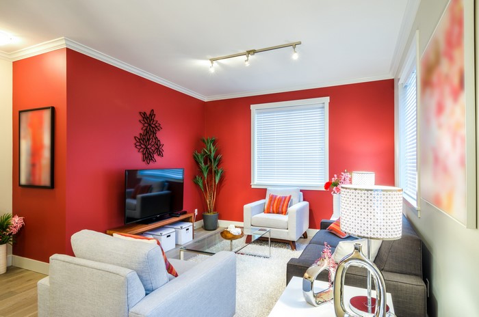 Modern living room with red walls and furniture