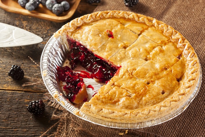 Blackberry pie with a slice removed