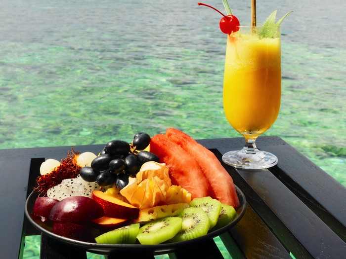 Fruit platter and juice by the ocean