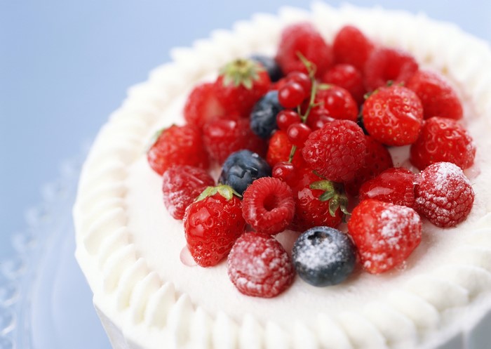 Cake with fresh berries and whipped cream