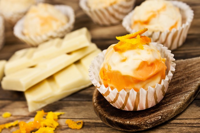 White chocolate bars and orange sweets