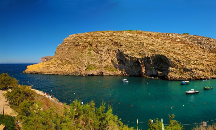 Rocky Coastline and Boats in Malta
