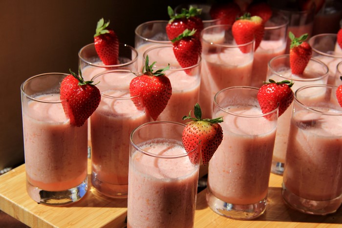 Many strawberry drinks in highball glasses