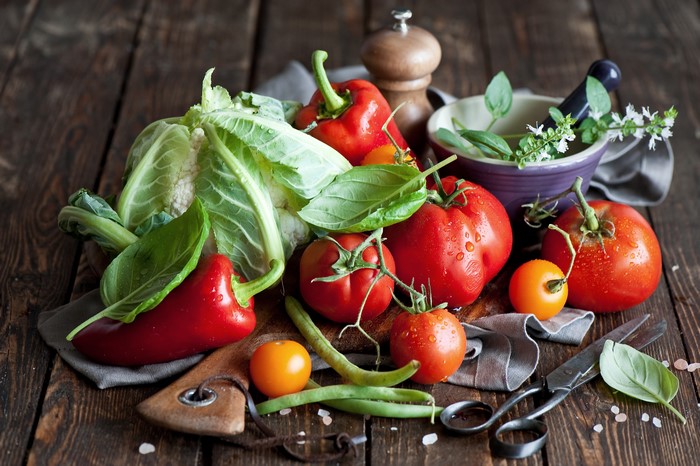 Vegetables and Tomatoes on a Wooden Table