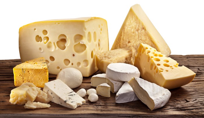 Assortment of Cheeses on Wooden Surface