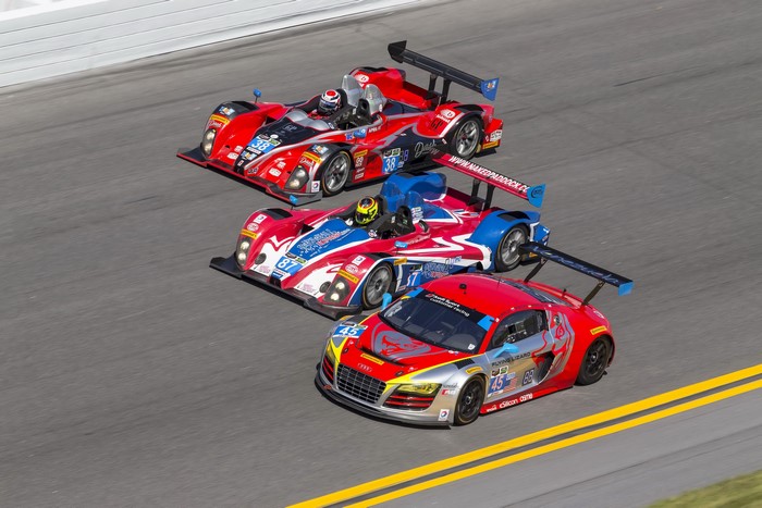Three race cars on a track