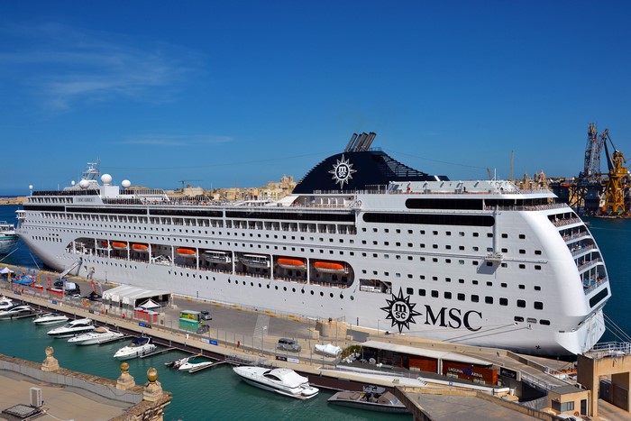 MSC Lirica cruise liner docked in a marina