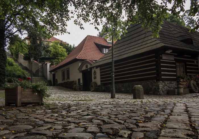 Cobblestone street with traditional houses in Prague