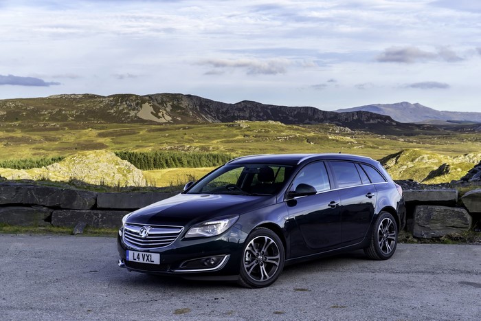 Dark blue Vauxhall Insignia Sports Tourer parked in a mountainous landscape