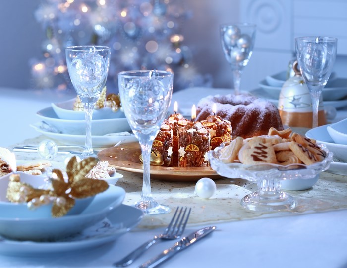 Christmas Table Setting with Candles and Cake