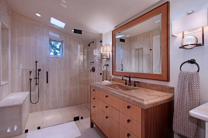 Modern bathroom with wood vanity and glass shower
