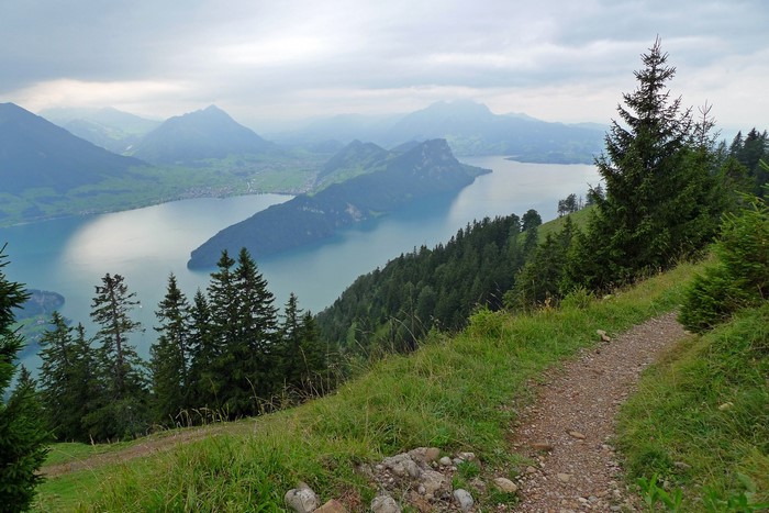 Lake and mountains with a hiking trail in Switzerland