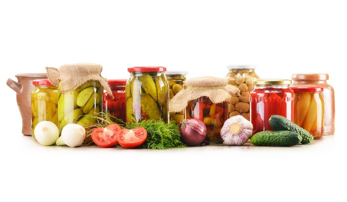 Jars of Pickled Vegetables and Fresh Produce