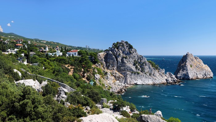 Rocky coast with buildings and the sea in Crimea, Russia