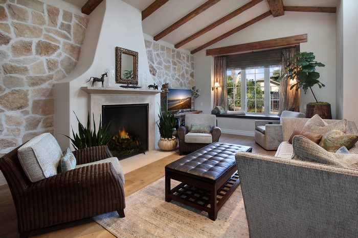 Living room with stone fireplace and comfortable seating