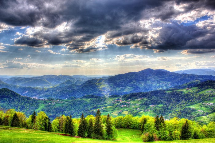 Mountains and Forests in Slovenia under Dramatic Sky