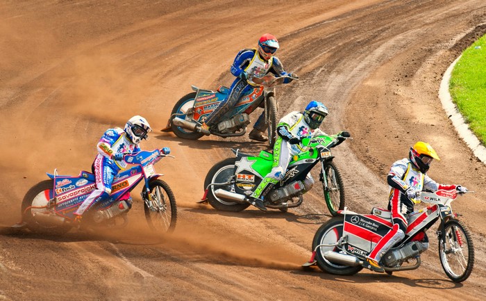 Motorcyclists racing on a dirt track