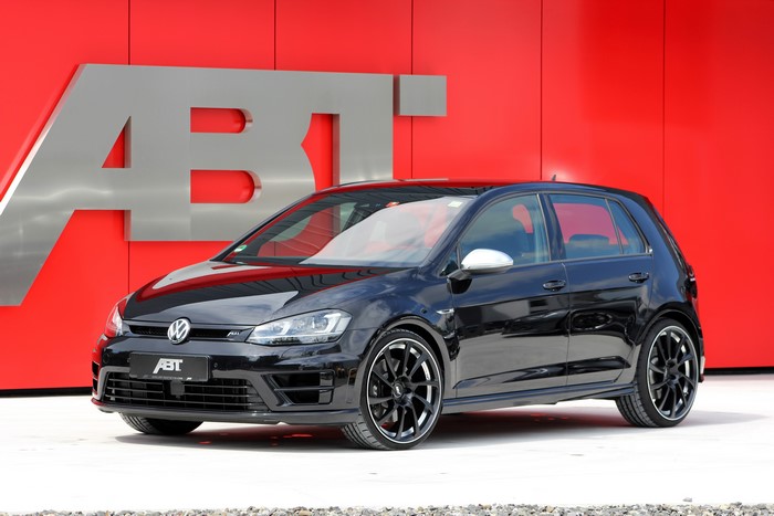 Black Abt Volkswagen Golf VII R in front of ABT logo