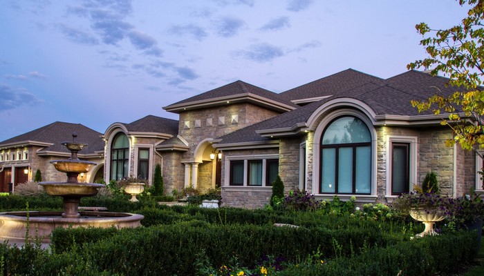 Luxury mansion with fountain and manicured garden