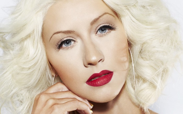 Christina Aguilera with blonde hair and red lipstick