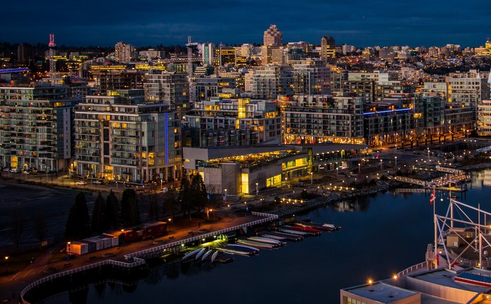 Vancouver cityscape at night with waterfront and buildings