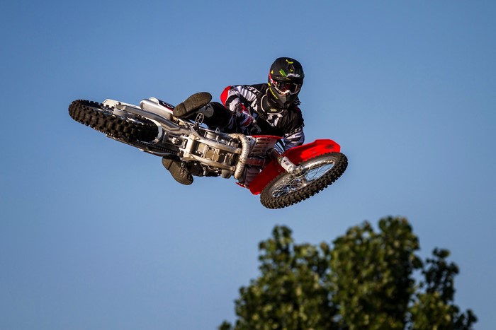 Motocross rider performing a jump