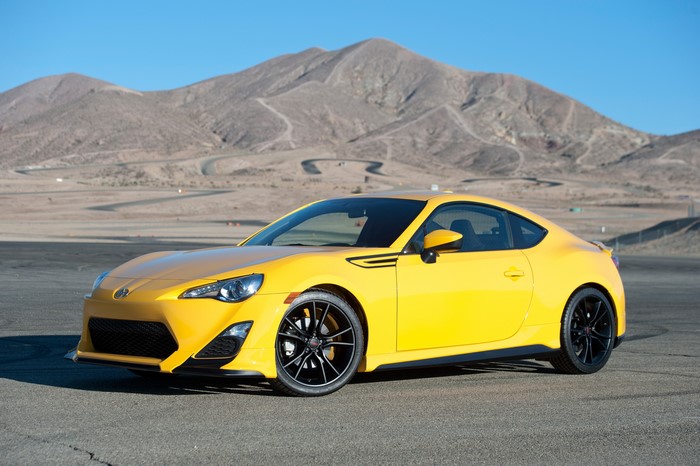 Yellow 2014 Scion FR-S Release Series 1.0 on a Racetrack