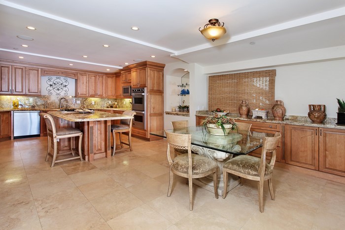 Kitchen with island, dining table, and chairs
